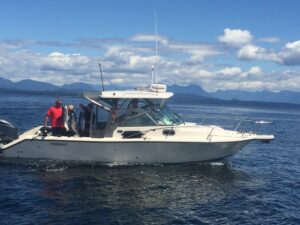 Lacey Sacrey from Alberta with her mom Stella and Eddy Philpot fishing image