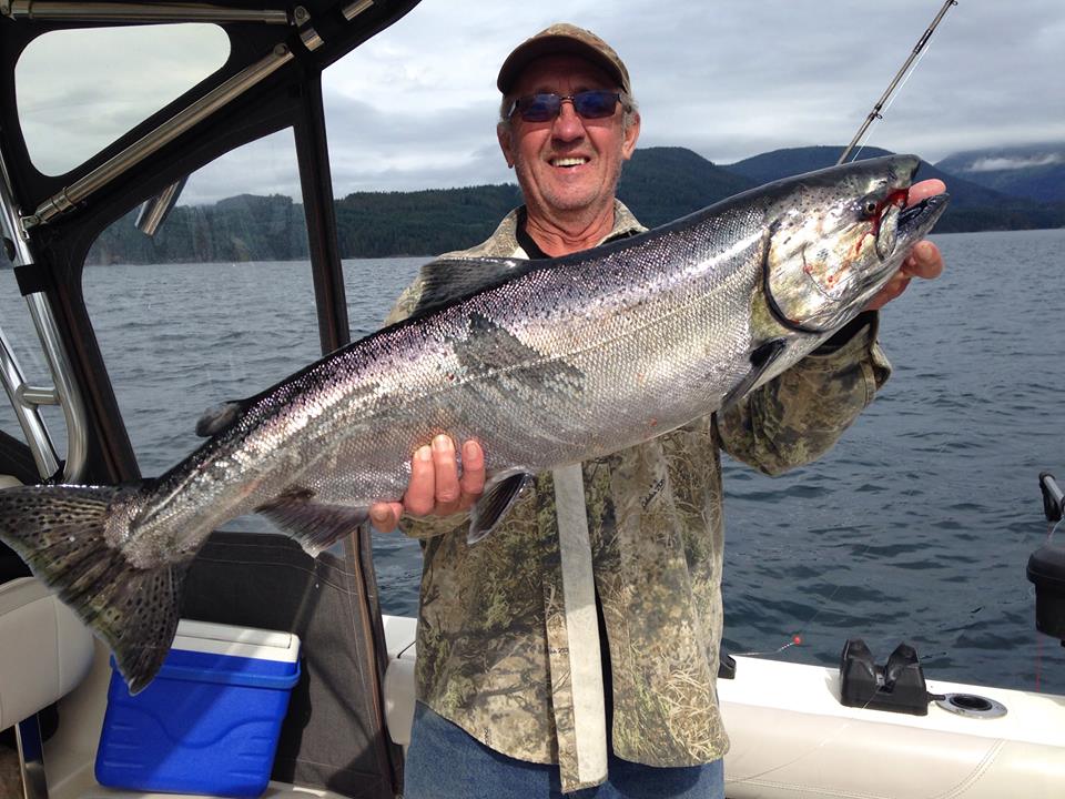 man captured a Chinook salmon image